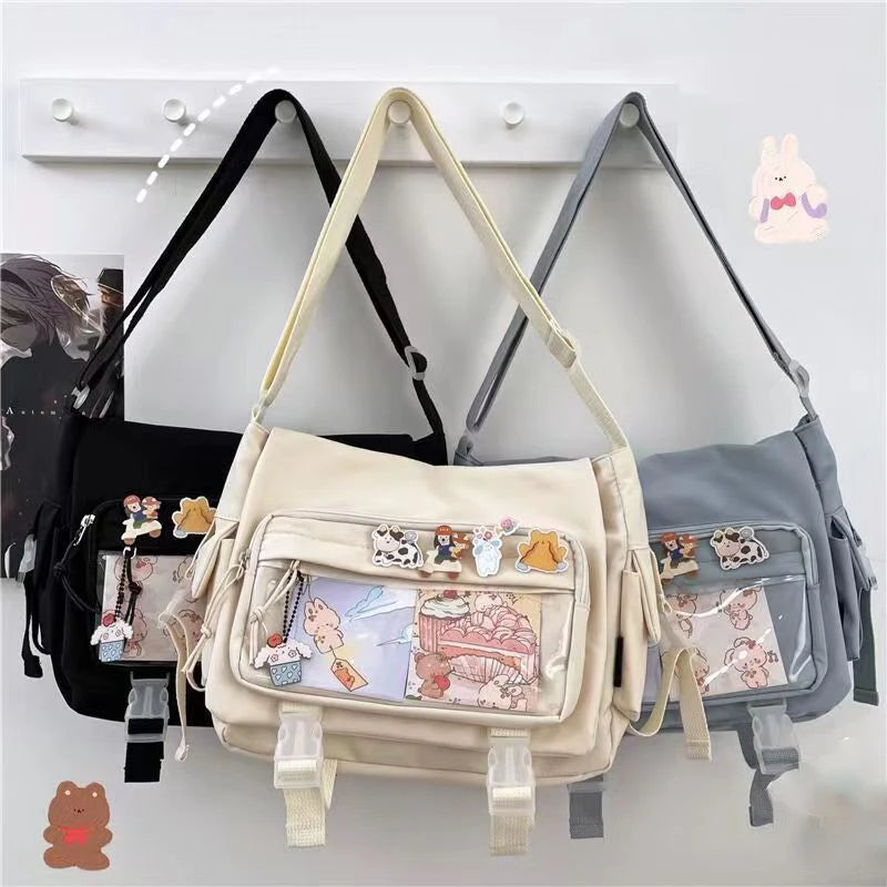 Beige Kawaii crossbody bag with decorative elements hanging on a rack.