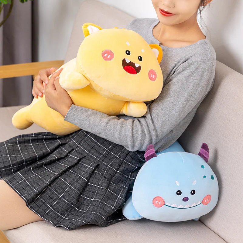 Person holding a yellow kawaii plush toy with a surprised expression on a couch.