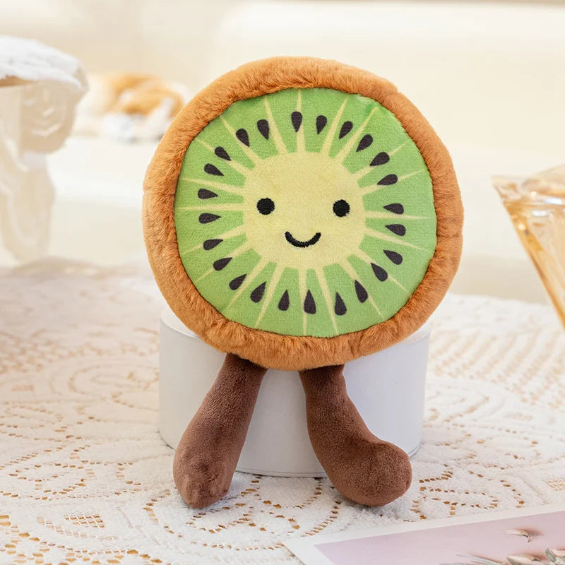 Plush kawaii toy shaped like a kiwi fruit on a white surface
