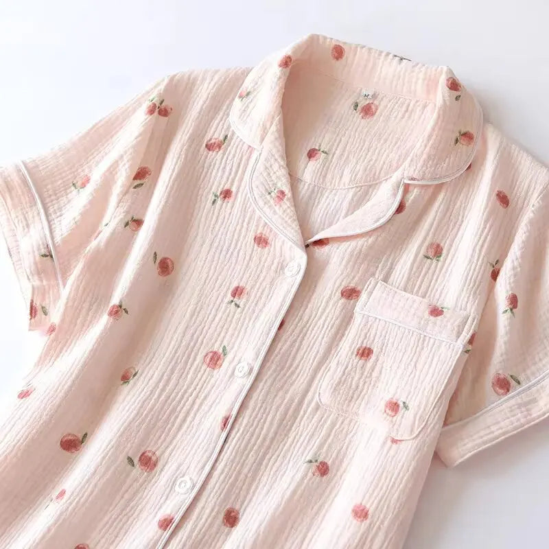 Pink kawaii pajama top with peach pattern on a white background