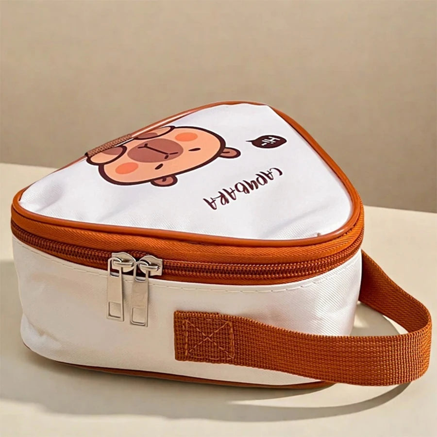 Heart-shaped bag with kawaii cartoon design and brown strap on a beige background
