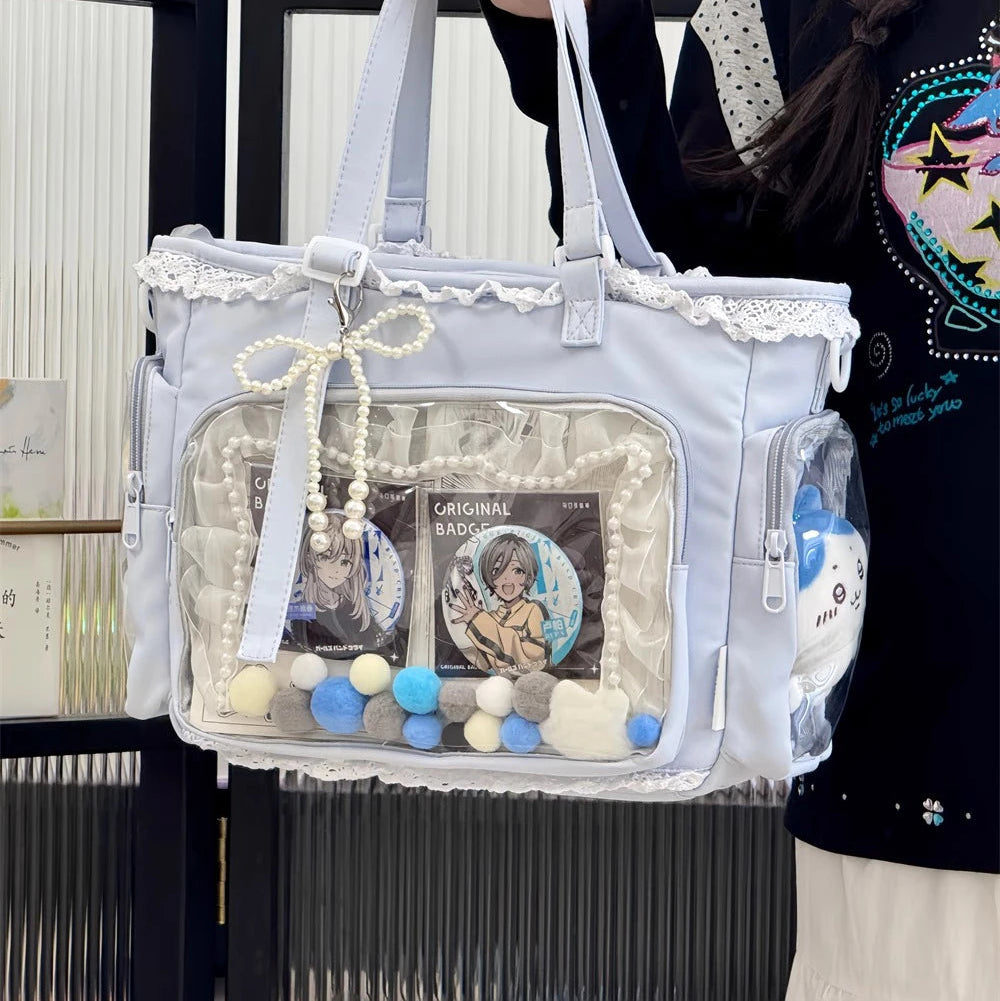 Clear Kawaii handbag with decorative elements held by a person against a blurred background