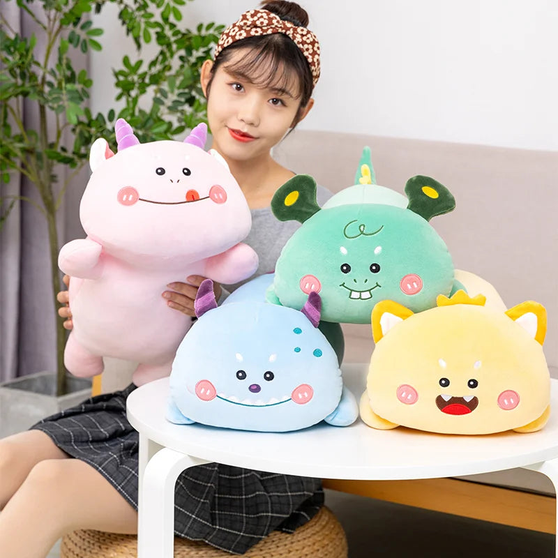 Person holding colorful kawaii plush toys on a table with a plant in the background