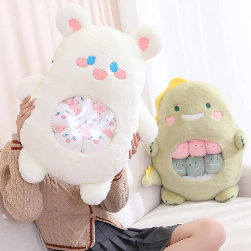 Two kawaii plush toys, one white and one green, held by a person against a light background.