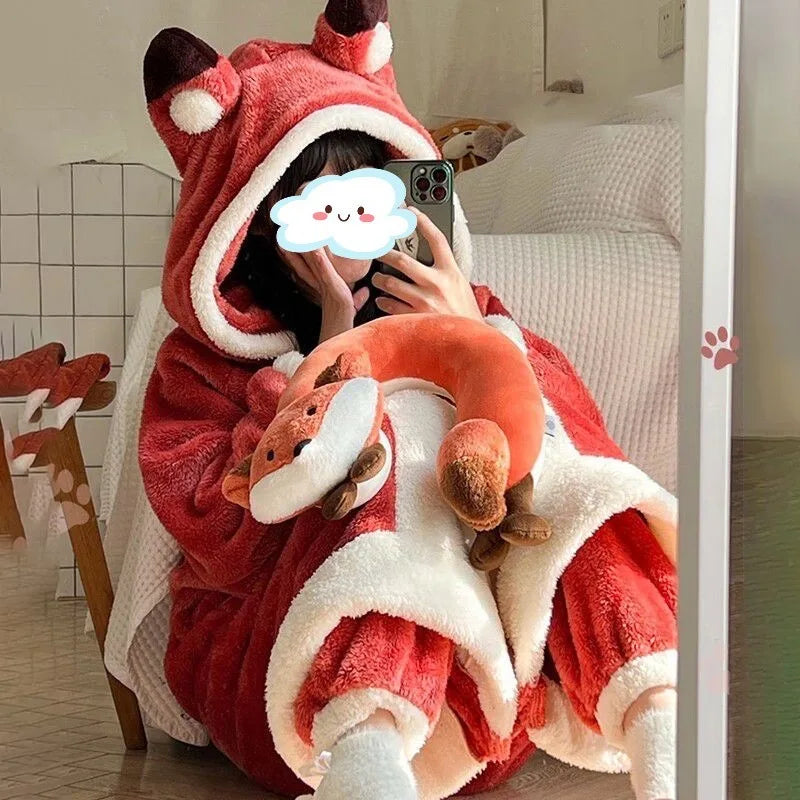 Person wearing a red and white kawaii fox-themed onesie in a room.