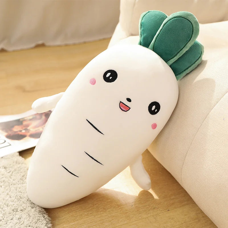 Kawaii plush carrot toy with a smiling face on a wooden floor.
