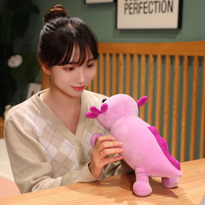 Woman holding a pink plush kawaii toy at a wooden table with a blurred background