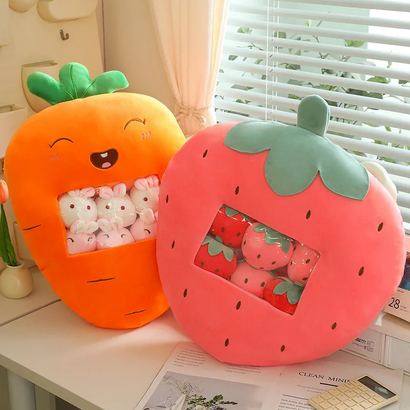Carrot and strawberry-shaped kawaii cushions with plush toys inside on a desk.