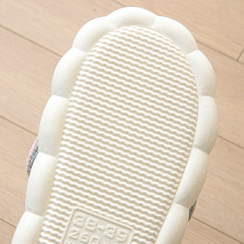Close-up of a white kawaii shoe sole with text on a beige background