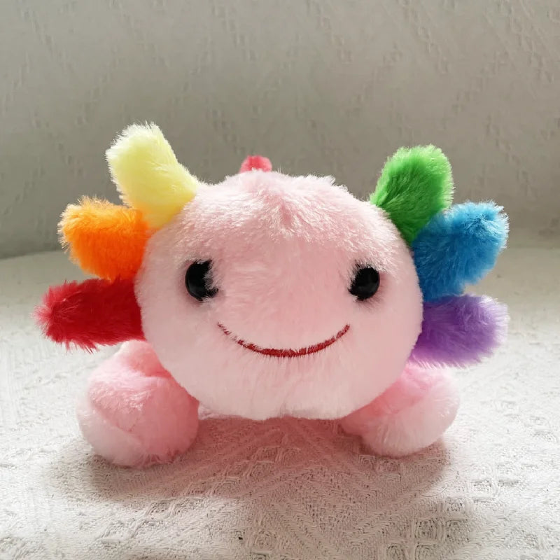 Kawaii plush toy with a rainbow-colored mane on a neutral background