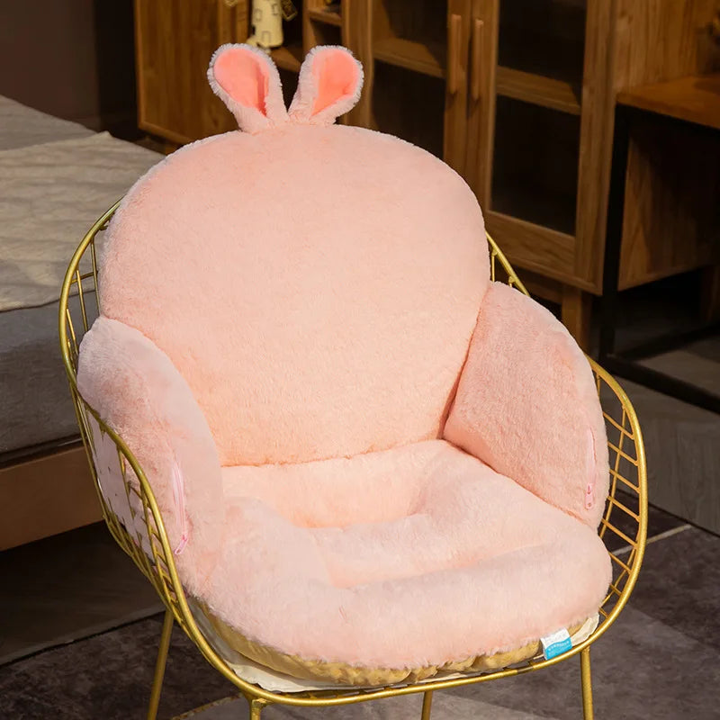 Pink kawaii plush chair with bunny ears on a gold wire frame chair in a room setting.