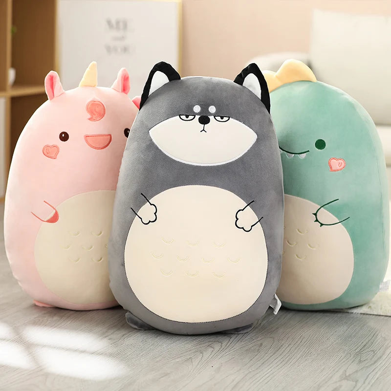 Three kawaii cute plush toys with animal faces on a wooden surface.