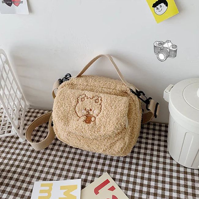 Beige plush bag with Kawaii bear design on a checkered floor