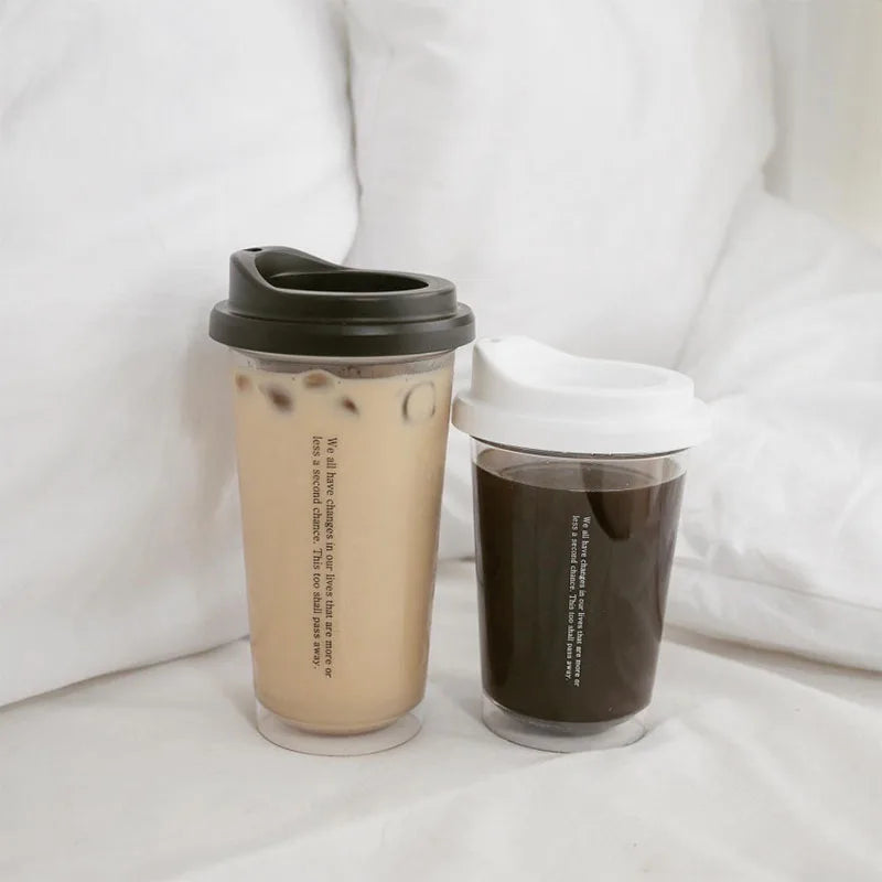 Two reusable Kawaii coffee cups with different beverages on a white background
