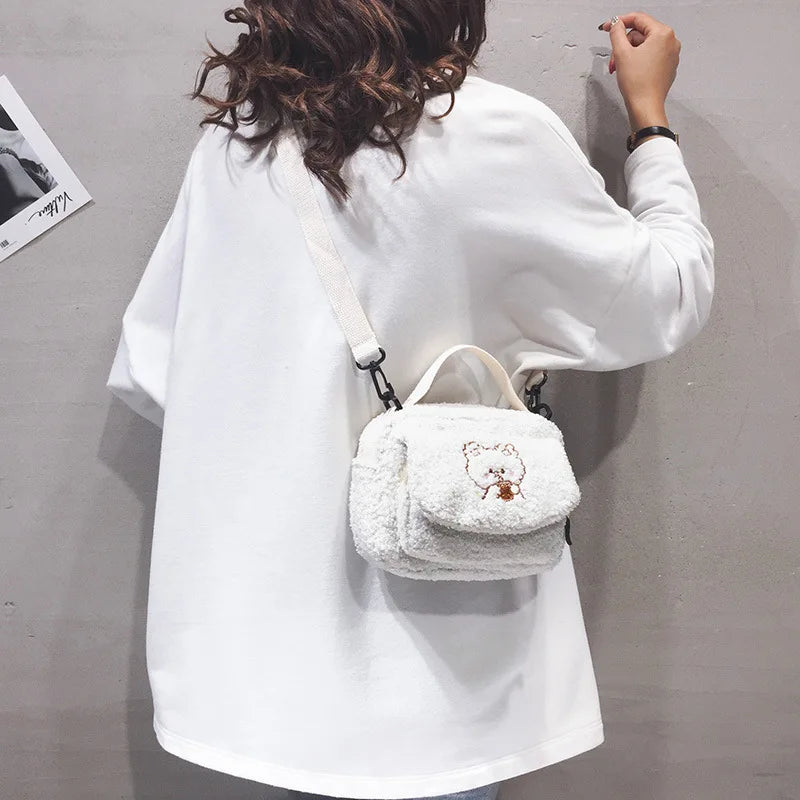 Person wearing a white fluffy bag with a Kawaii cartoon design on a plain background