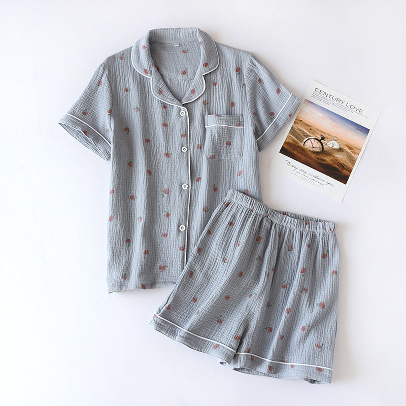 Gray kawaii patterned pajama set with a magazine on a white background