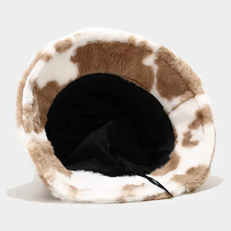 Fur-lined Kawaii hats with cow print pattern on a white background