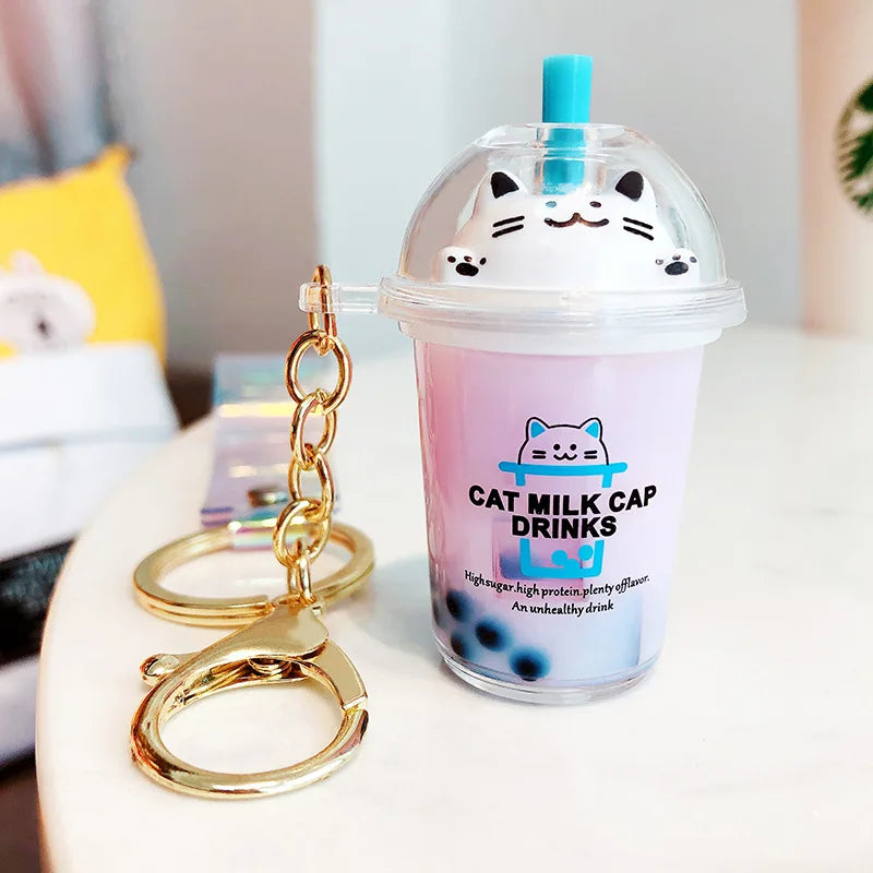 Cat-themed kawaii milk cap drink with a keychain on a blurred background
