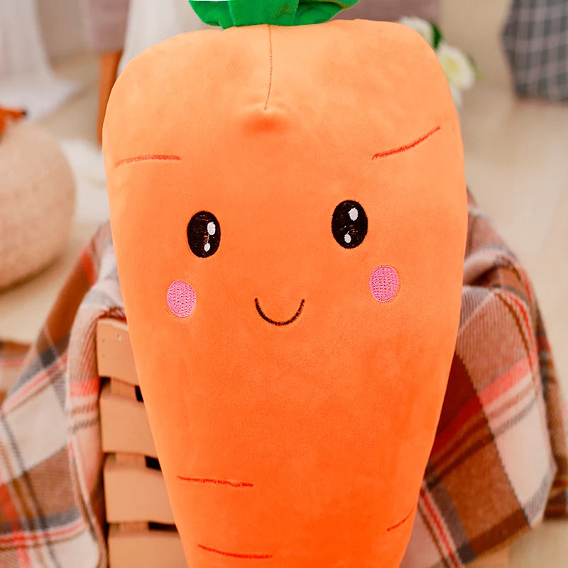 Carrot-shaped kawaii plush toy with a smiley face on a plaid blanket