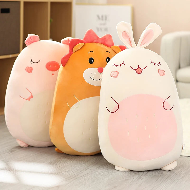 Three kawaii cute animal-shaped plush toys on a wooden floor.