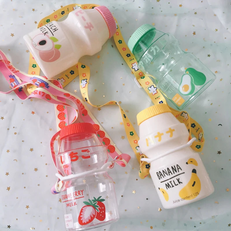 Set of colorful Kawaii children's bottles with various designs on a light background