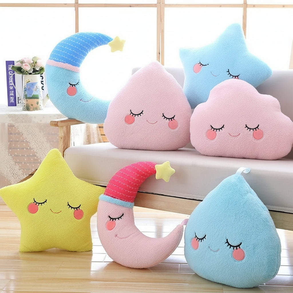 Set of cute kawaii plush toys shaped like stars, moon, and cloud with smiling faces on a wooden floor.