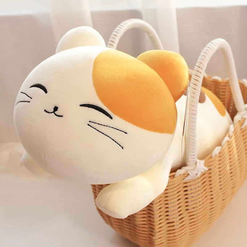 Plush kawaii cat toy with a yellow patch on a white background