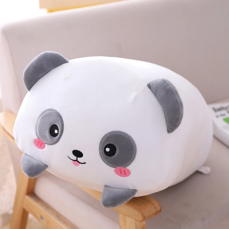 Plush kawaii panda pillow on a chair with a neutral background