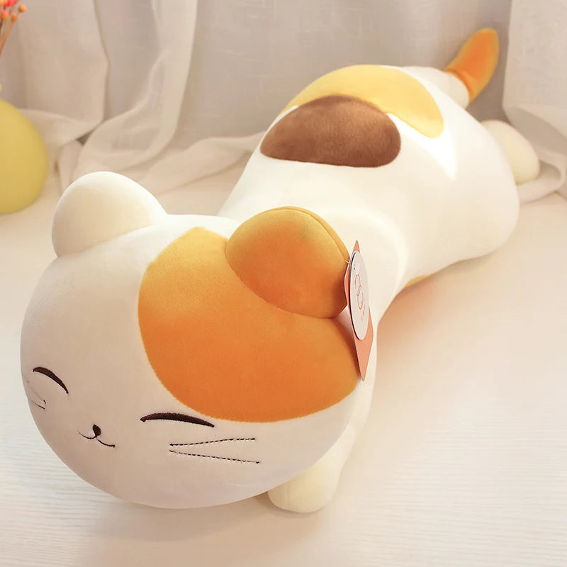 Plush kawaii toy shaped like a cat with orange and white colors on a light background