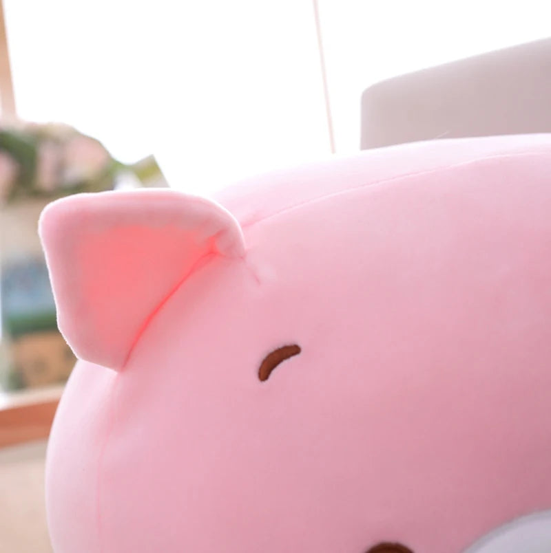 Close-up of a pink kawaii plush toy with a blurred background