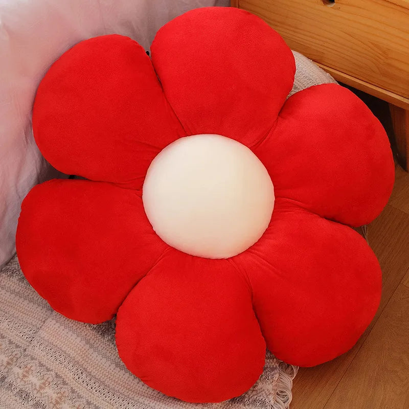 Red flower-shaped Kawaii cushion on a wooden floor