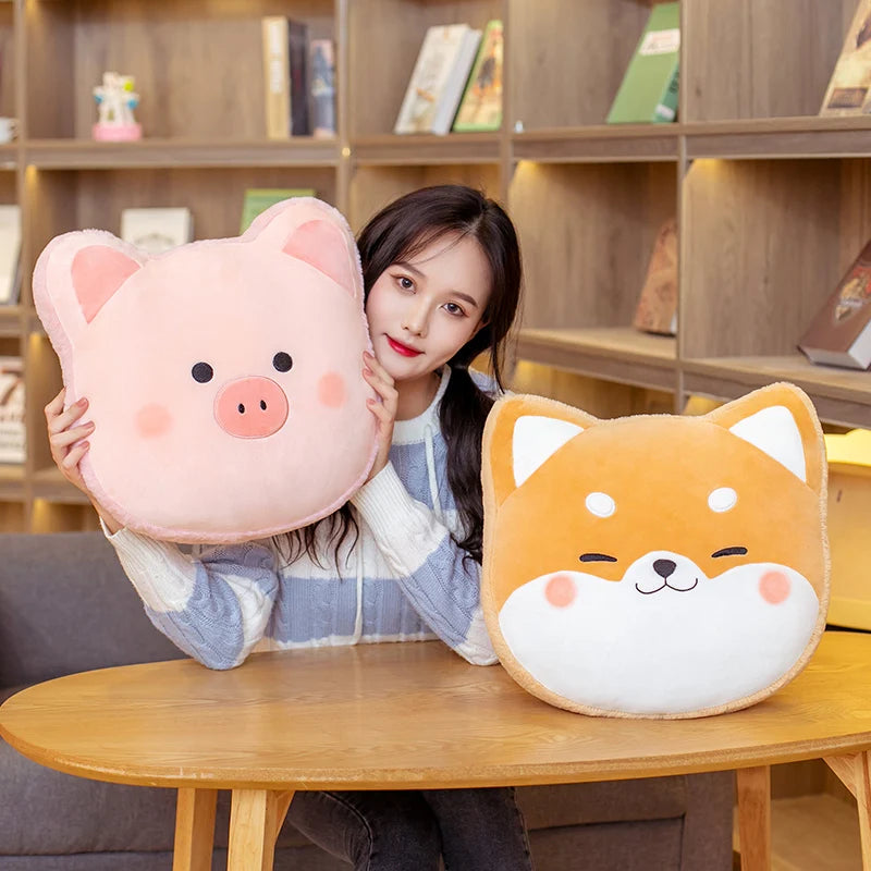 Woman holding a pink pig-shaped kawaii pillow and an orange dog-shaped pillow in front of a wooden bookshelf.