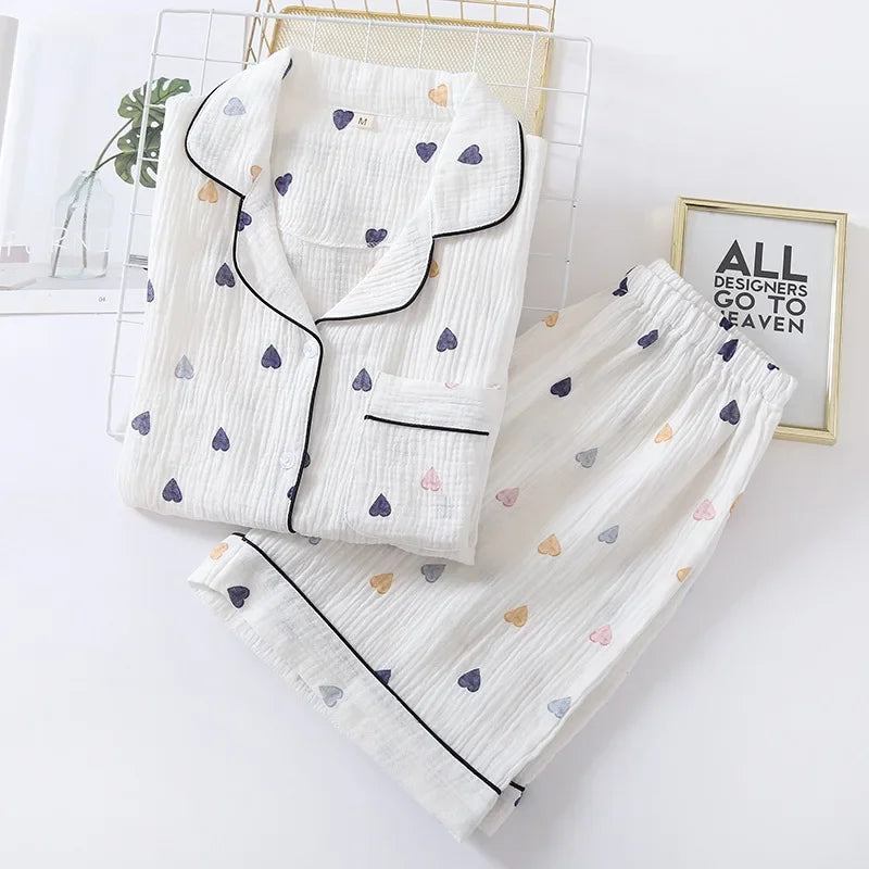 White pajama set with heart kawaii patterns on a white background