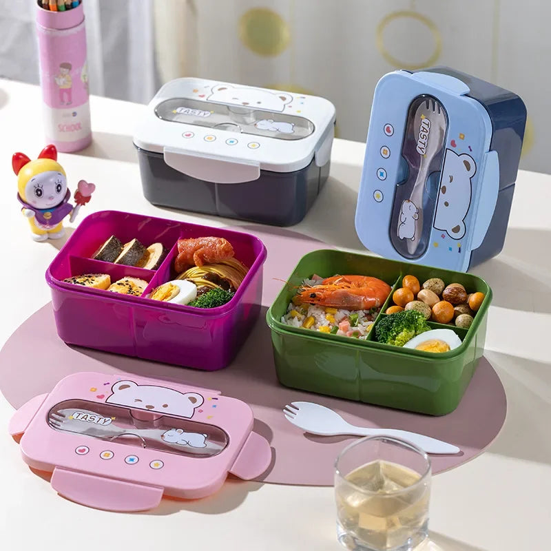 Set of colorful kawaii bento boxes with food and utensils on a table.