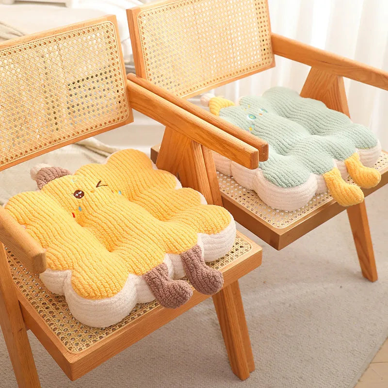 Two knitted animal-shaped kawaii cushions on wooden chairs with a light background
