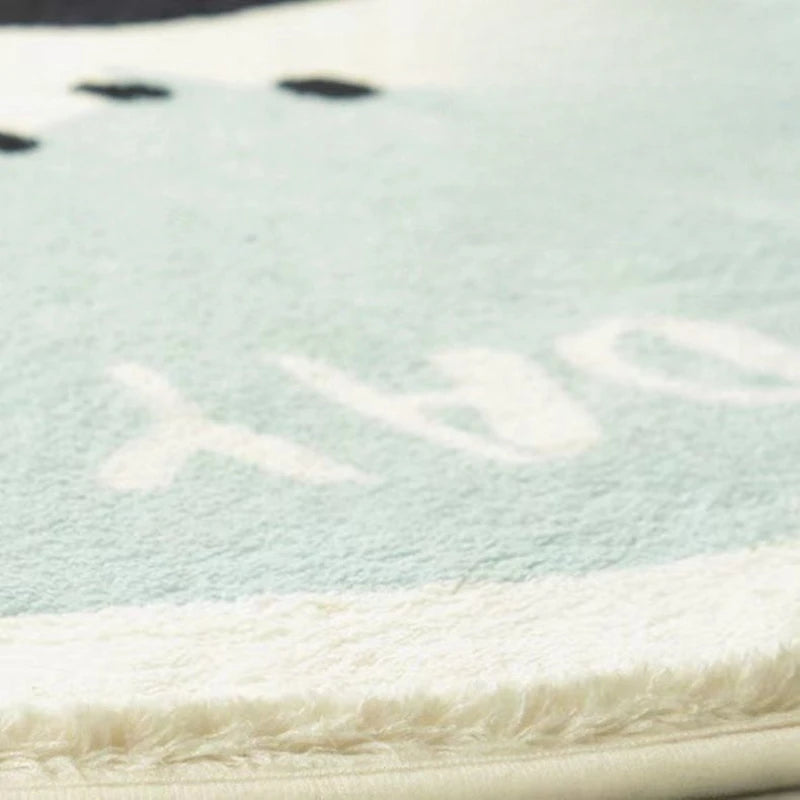 Close-up of a textured kawaii rug with white text on a light blue background