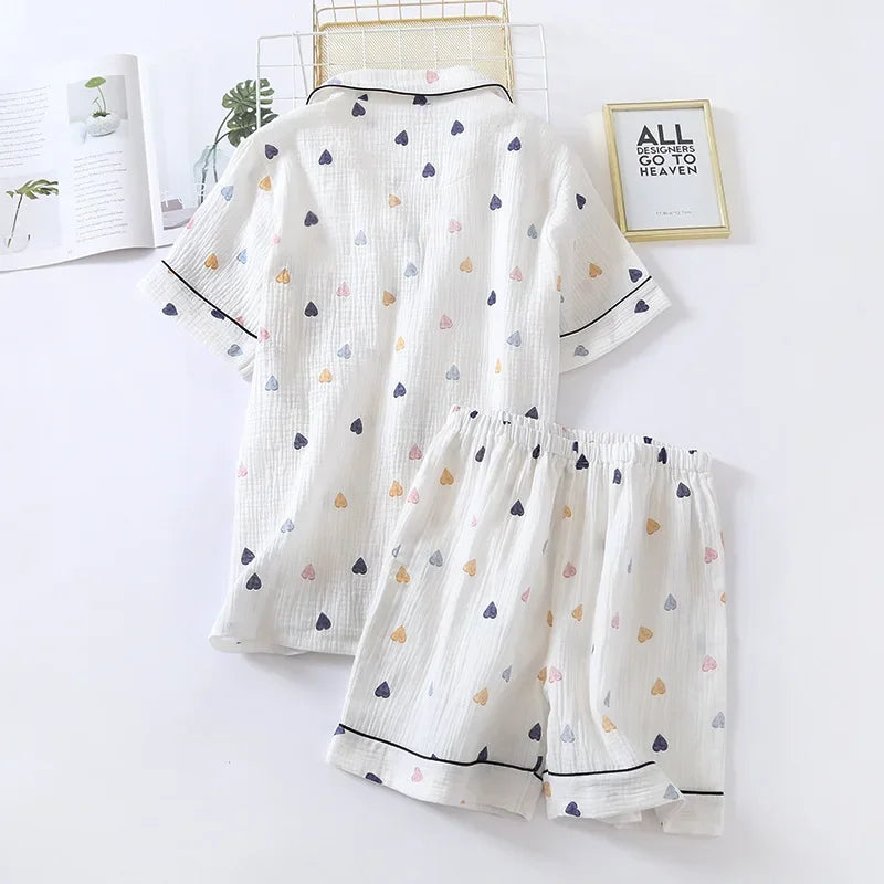 White pajama set with colorful kawaii heart patterns on a white background