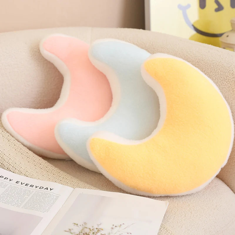 U-shaped kawaii pillow with gradient colors on a beige surface