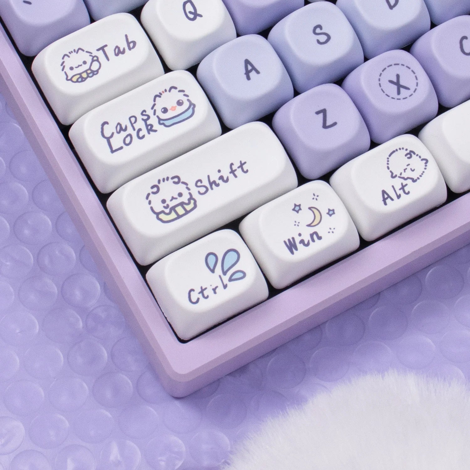 Close-up of a purple Kawaii keyboard with cartoonish key labels on a matching purple background