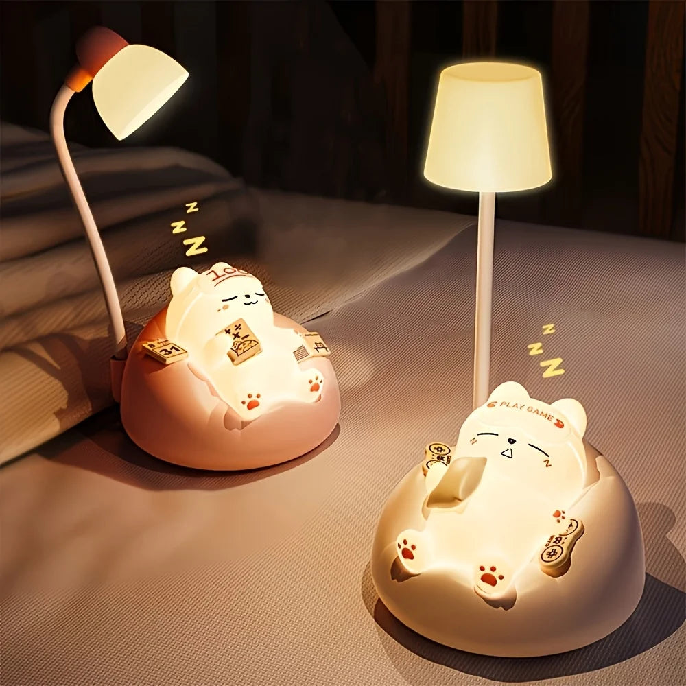 Two kawaii cartoon cat-shaped lamps on a surface with a dark background