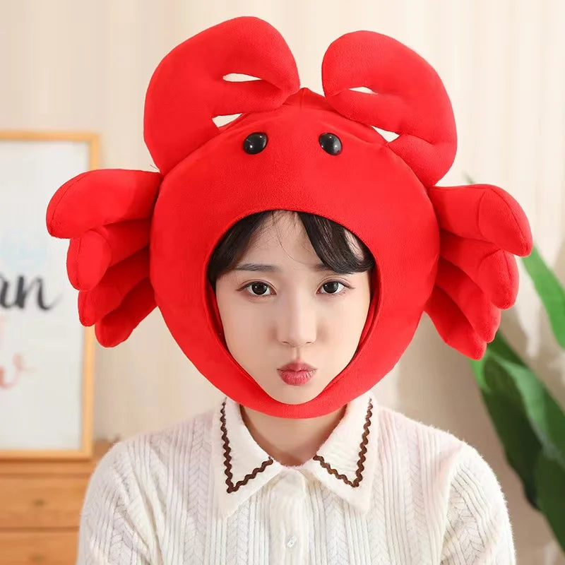 Person wearing a kawaii red crab-shaped hat indoors