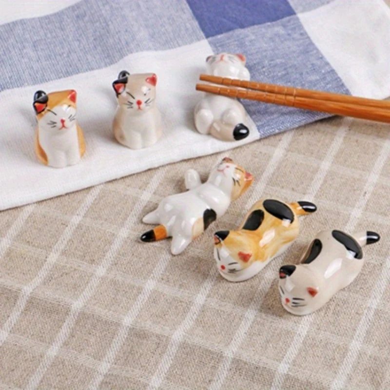Set of kawaii cat-shaped ceramic on a checkered tablecloth
