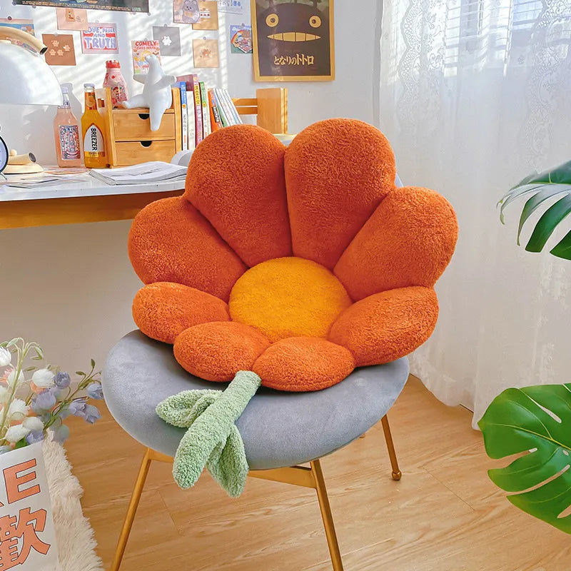 Kawaii flower-shaped chair with orange petals and gray base in a room setting