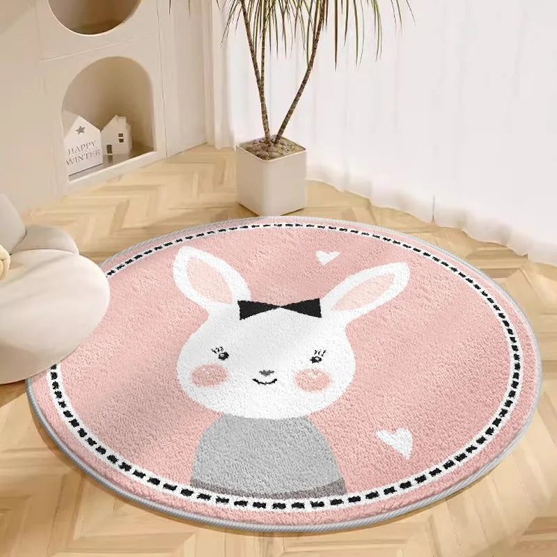 Round pink kawaii rug with a cartoon bunny design on a wooden floor.