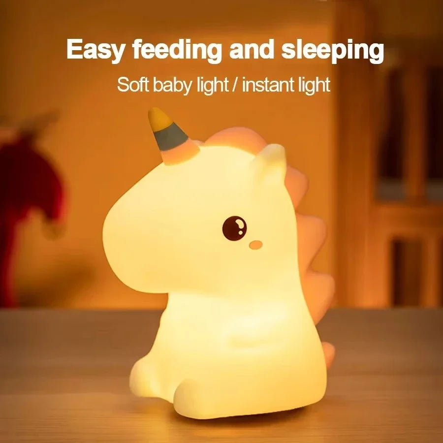 Kawaii unicorn-shaped night light on a wooden surface with text 'Easy feeding and sleeping' and 'Soft baby light / instant light'.