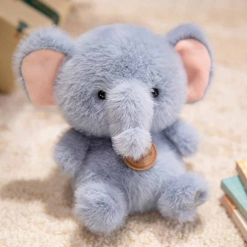 Plush elephant kawaii toy with a brown tag on a beige carpet