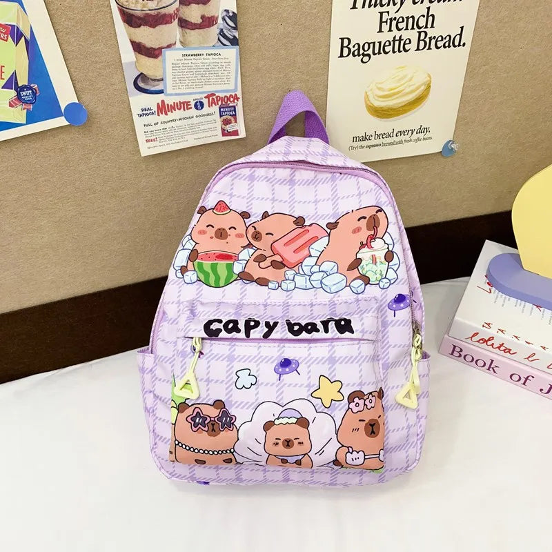 Backpack with Kawaii cartoon designs on a surface with posters in the background