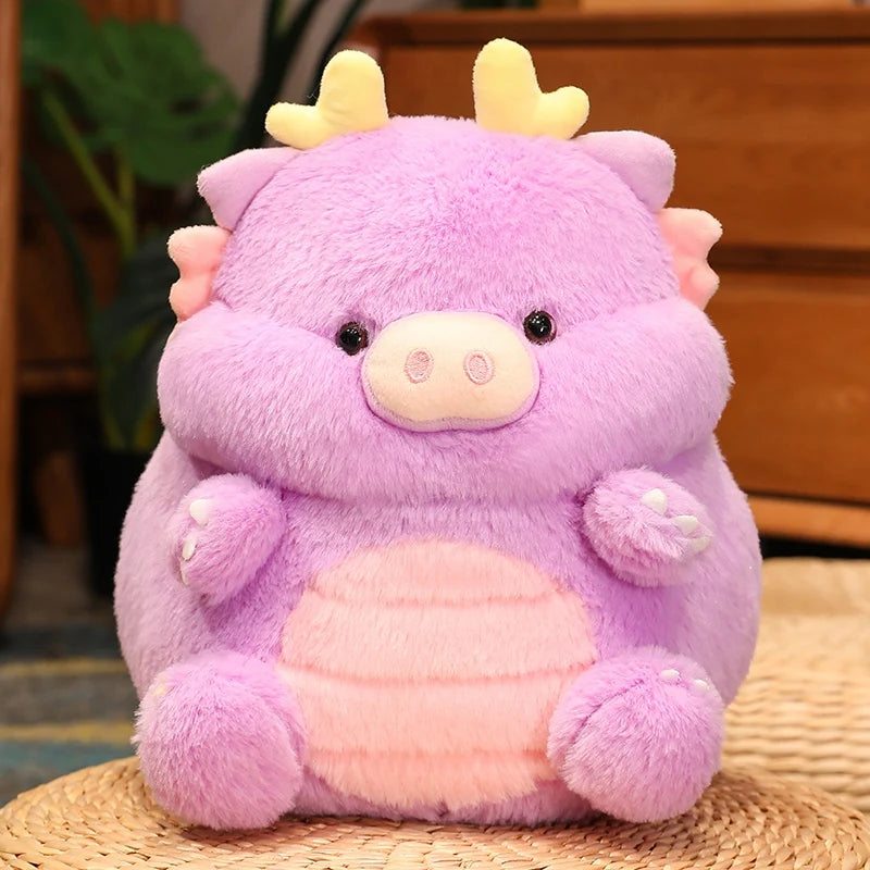 Purple kawaii plush toy with pink belly on a woven mat