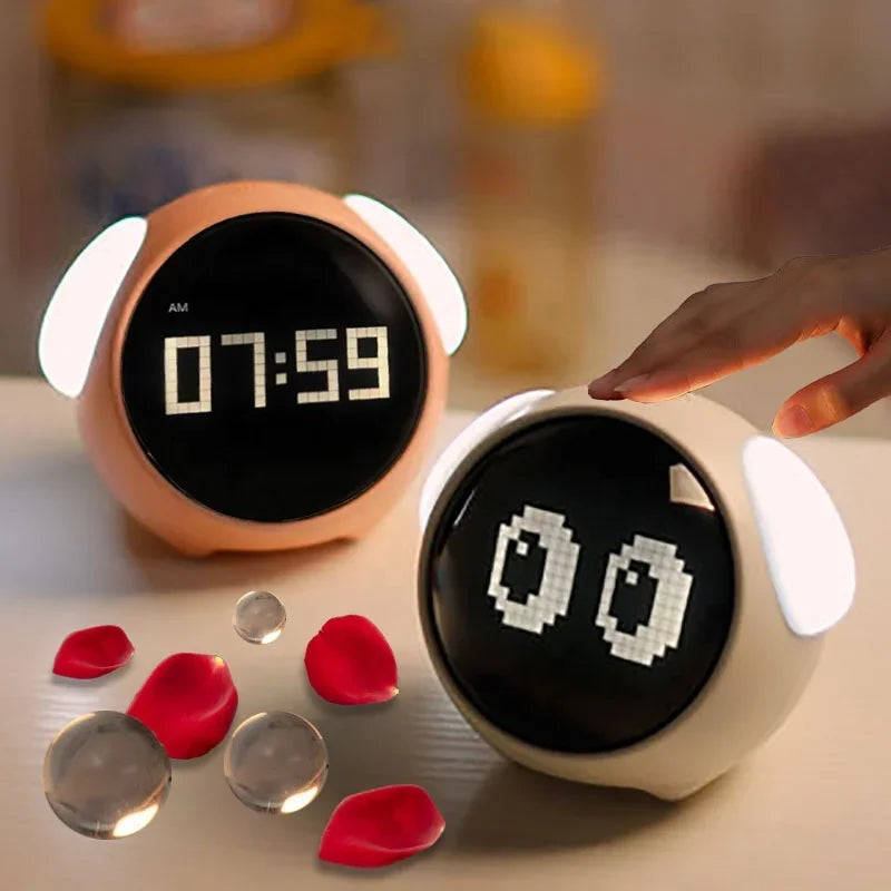 Two kawaii digital clocks on a surface with red petals and clear objects around them.