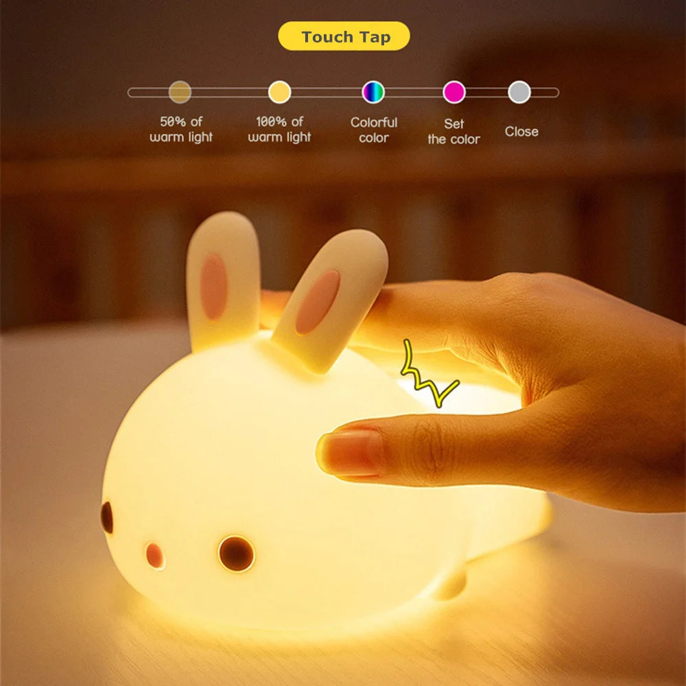 Hand interacting with a glowing rabbit-shaped kawaii night light